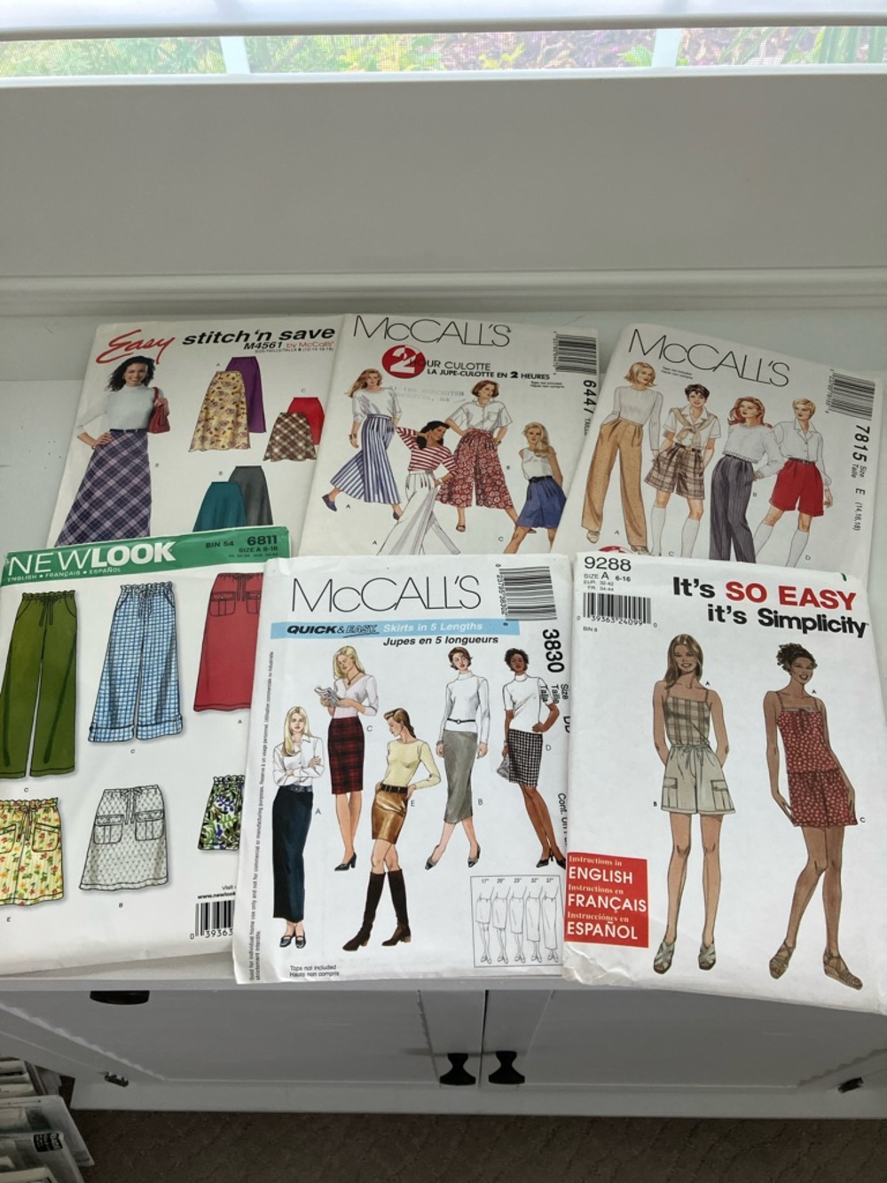 Six uncut sewing patterns women’s separate skirts pants shorts sizes 6–18